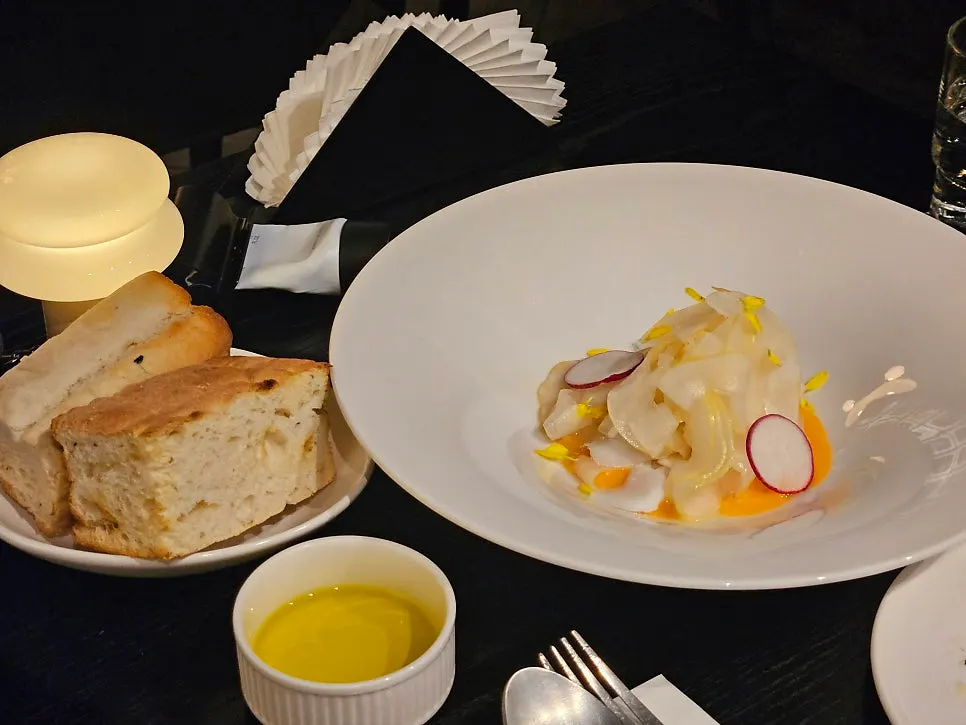 Focaccia and olive oil with squid-and-Korean melon carpaccio