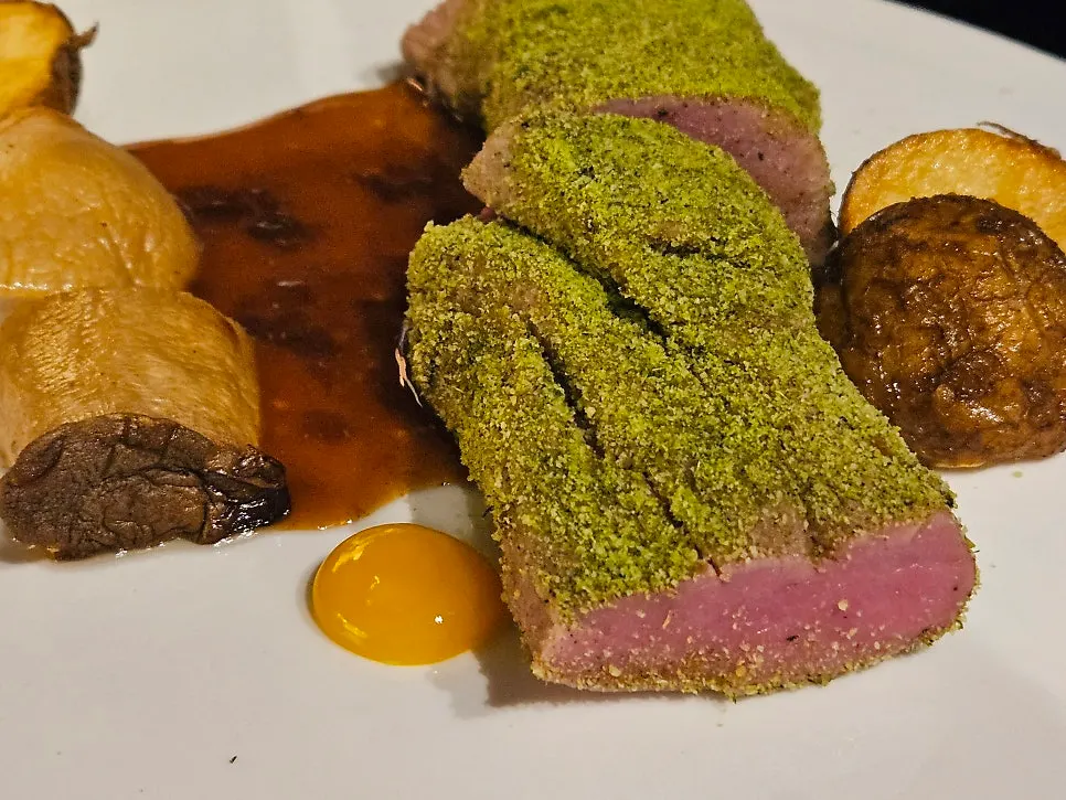 Black pork tenderloin steak with a rosy interior