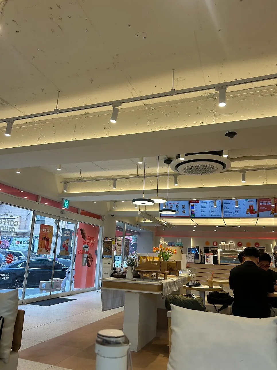Café interior presented as a student workspace