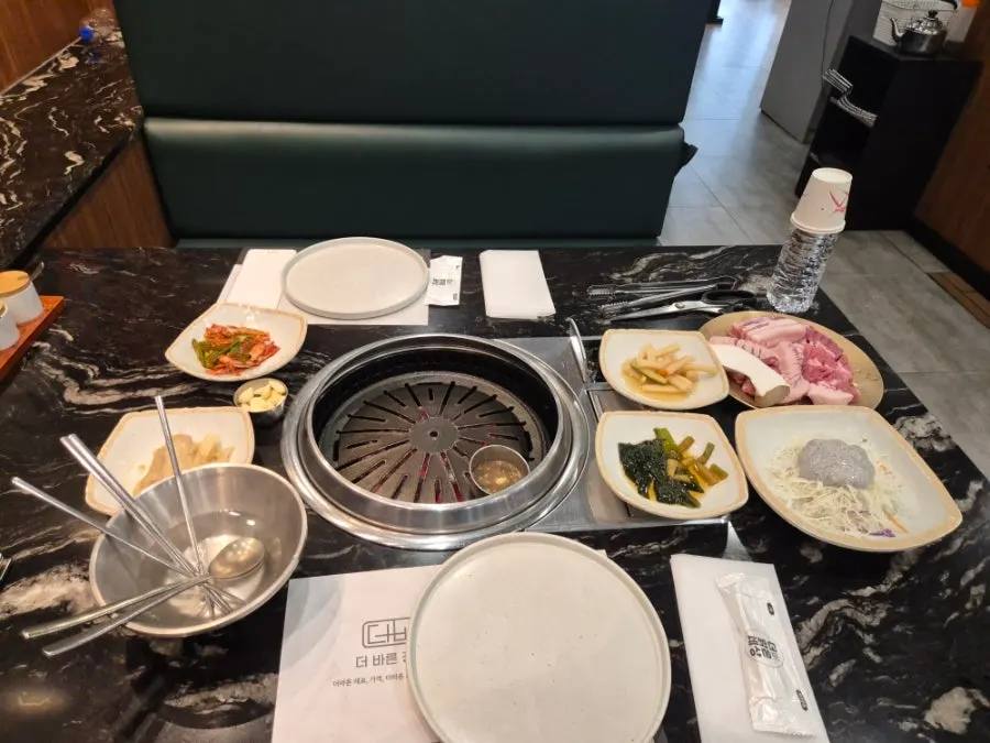 Banchan setup including myeongi-namul and pickled radish