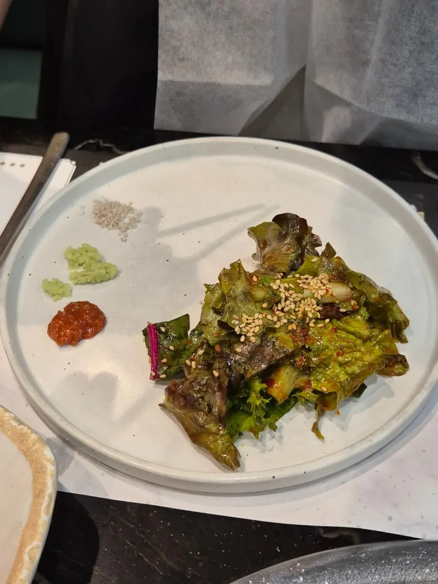 Sweet-and-sour seasoned lettuce salad piled up like a mountain