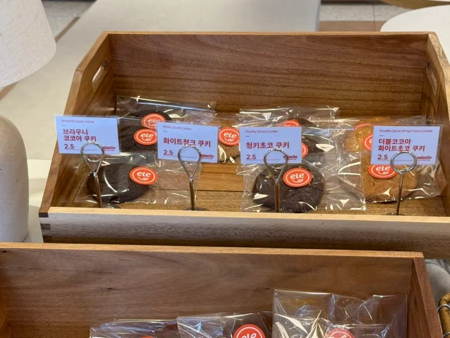 Bakery display case with cookies and scones