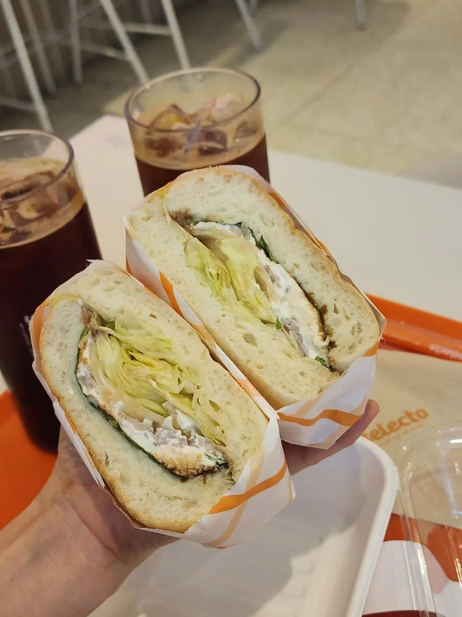 Cross-section of a sandwich with thick house-made ricotta cheese