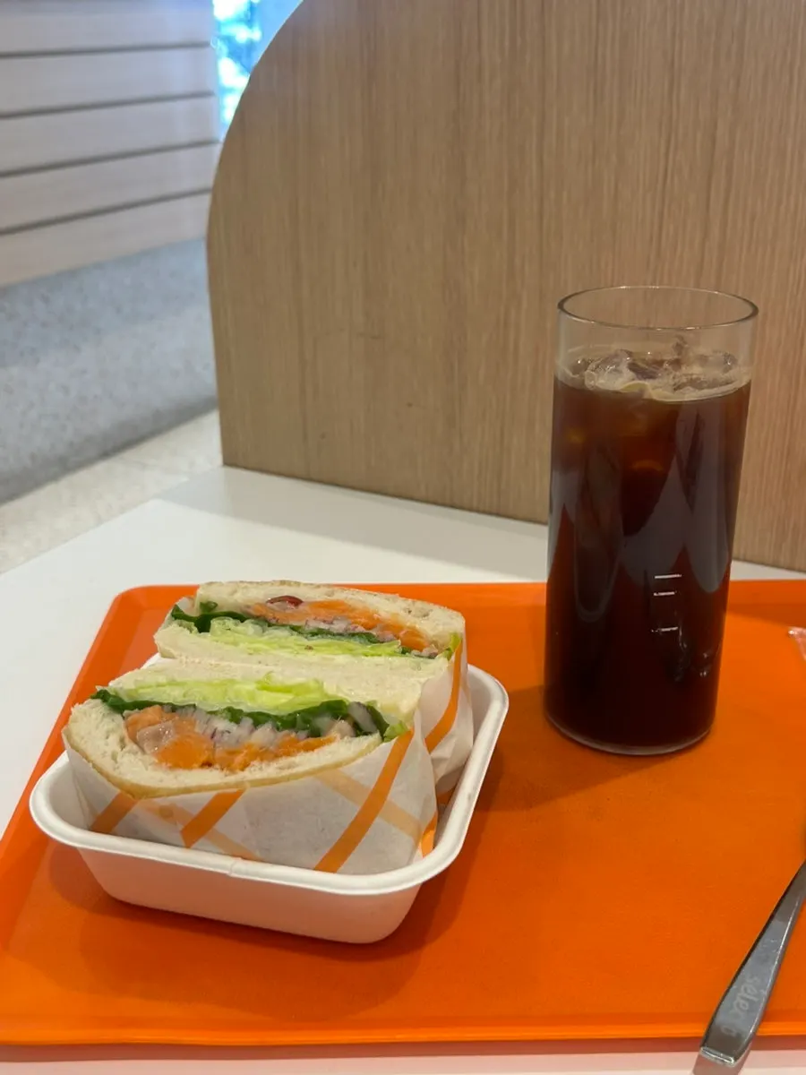 Cross-section of the salmon sandwich with one slice of bread remaining