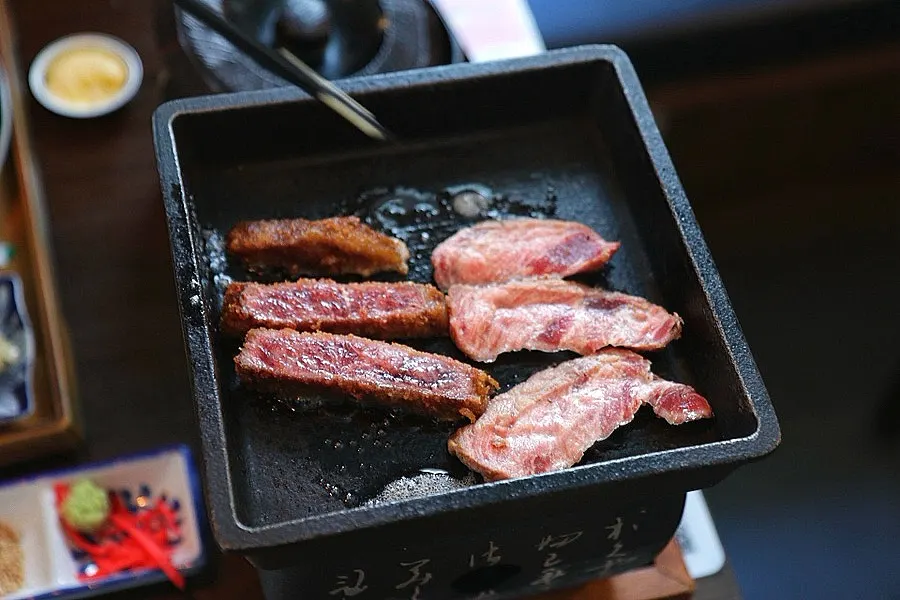 Meat grilling on a personal brazier