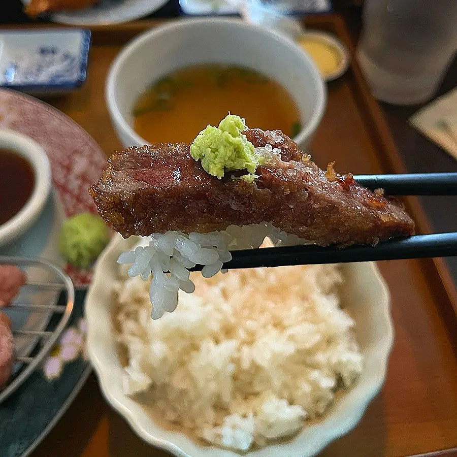 A bite of rice, gyukatsu, and wasabi