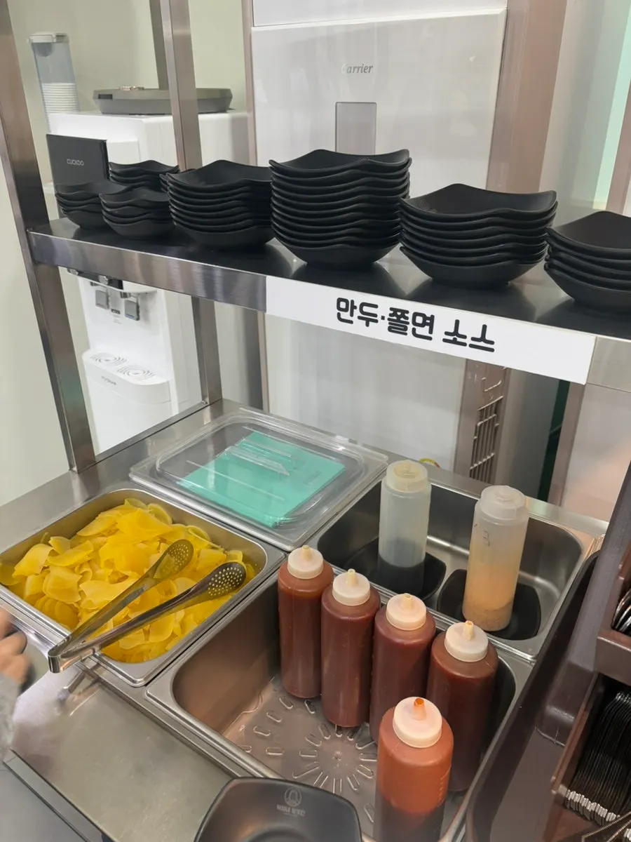 Sauces and pickled radish at the self-serve bar
