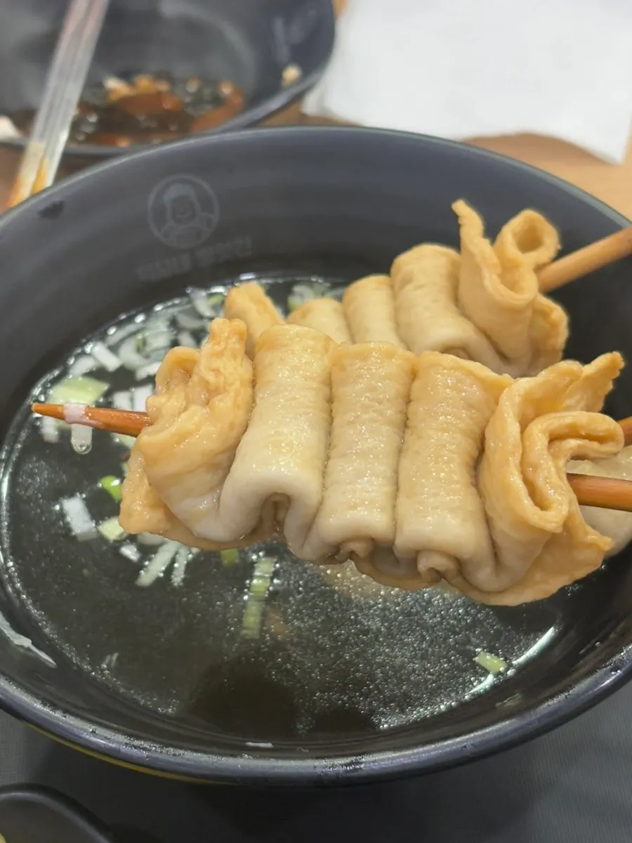 Eomuk generously coated in tteokbokki sauce