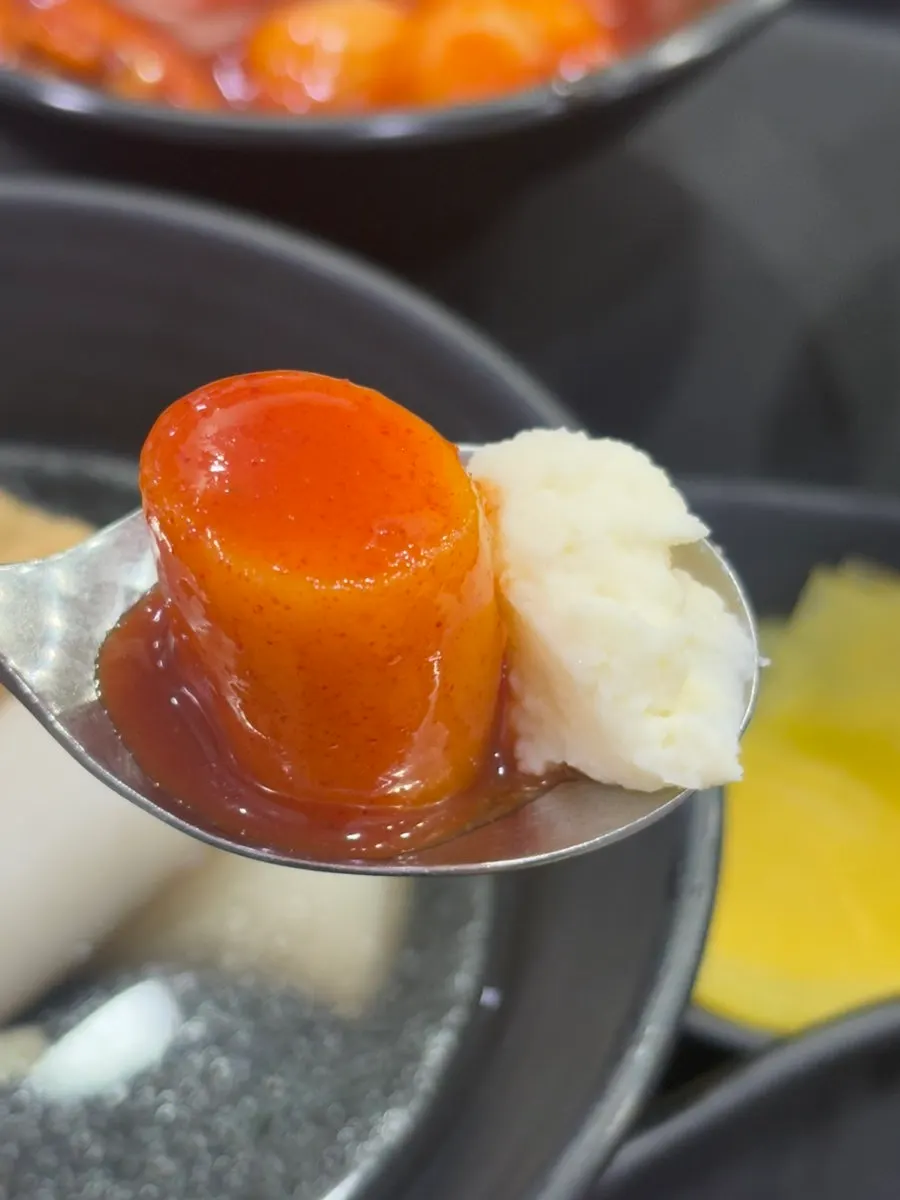 A bite combining rice cake and sundae