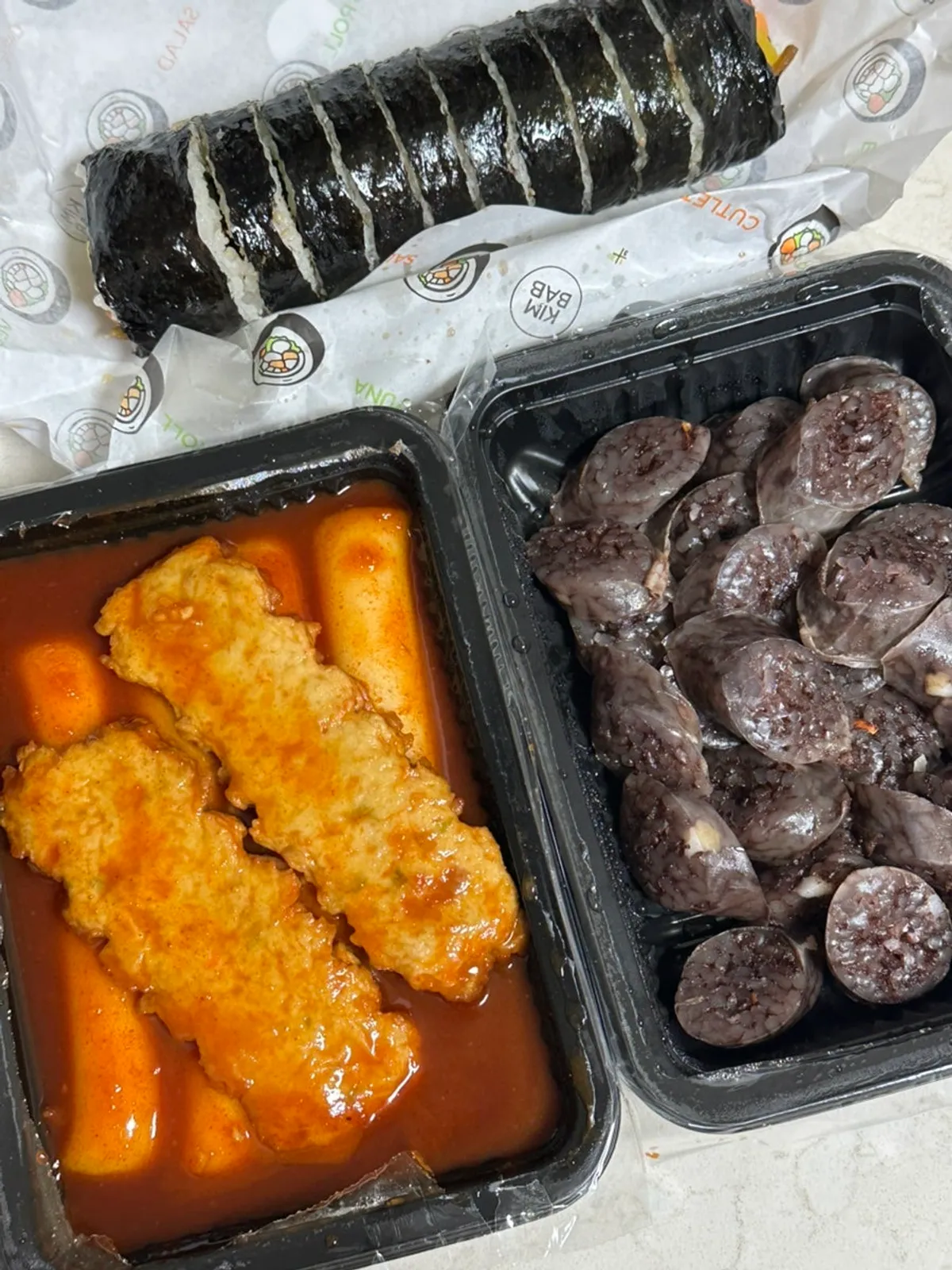 Garaetteok tteokbokki packed in a takeout container