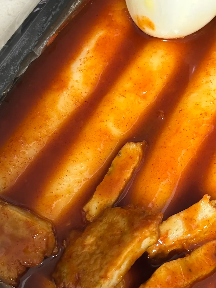 Close-up of sauce-soaked garaetteok tteokbokki