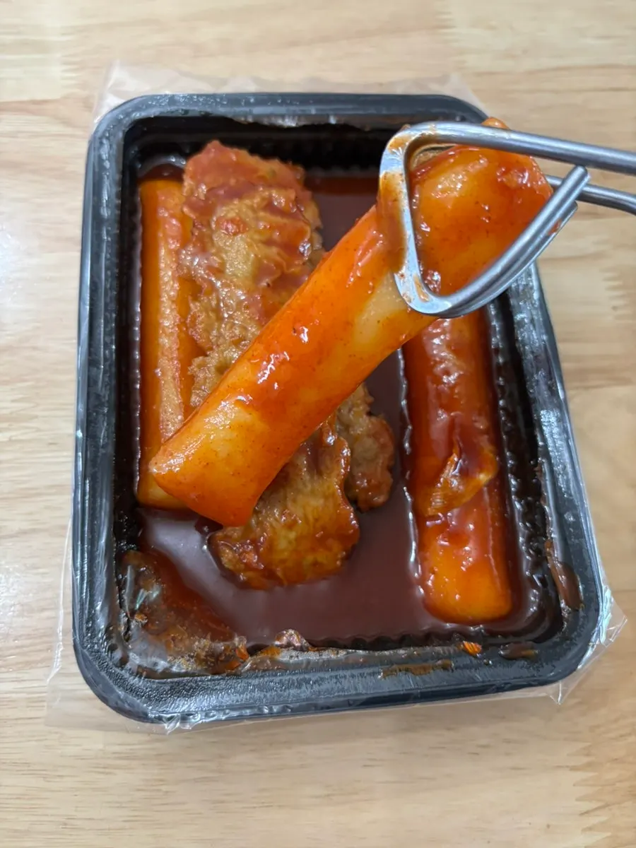 A sauce-coated piece of rice garaetteok