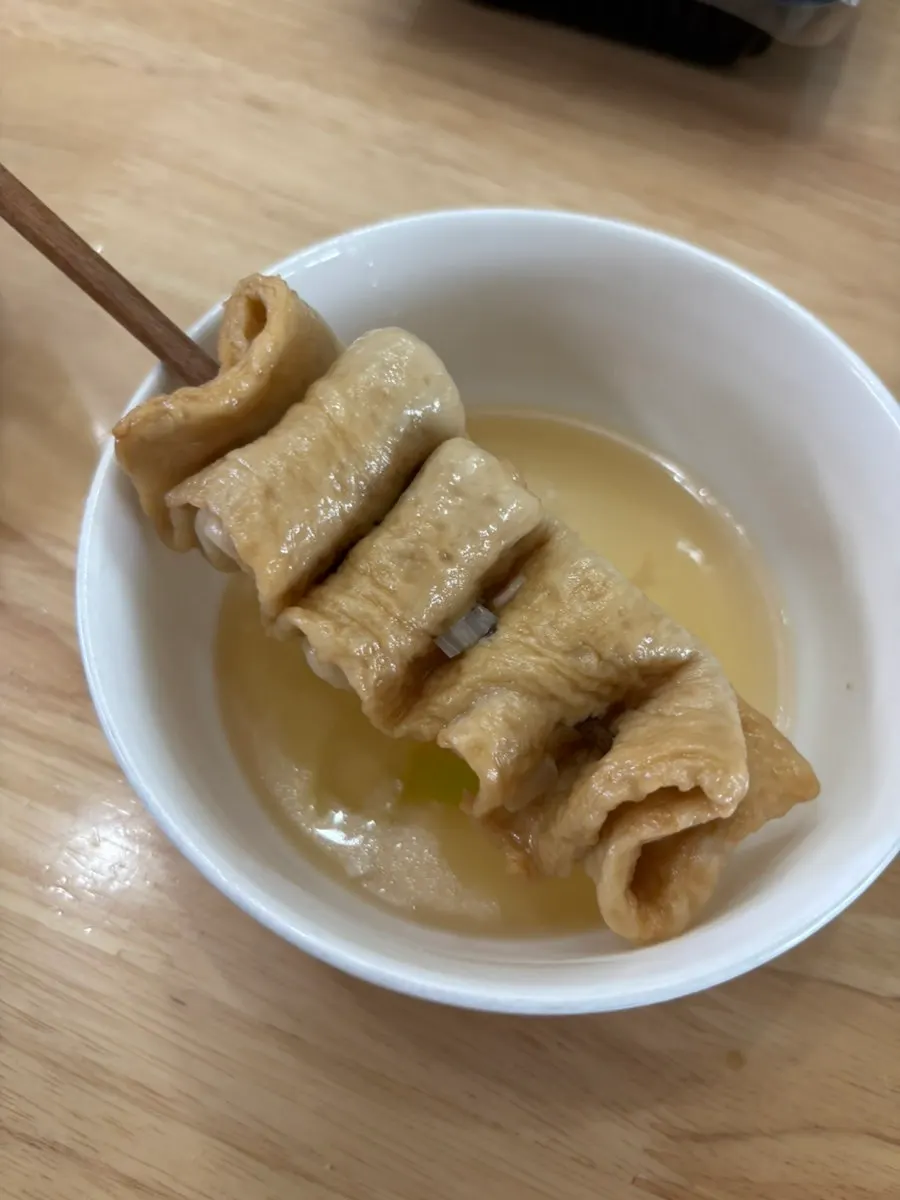 Fish cake skewered on a wooden chopstick