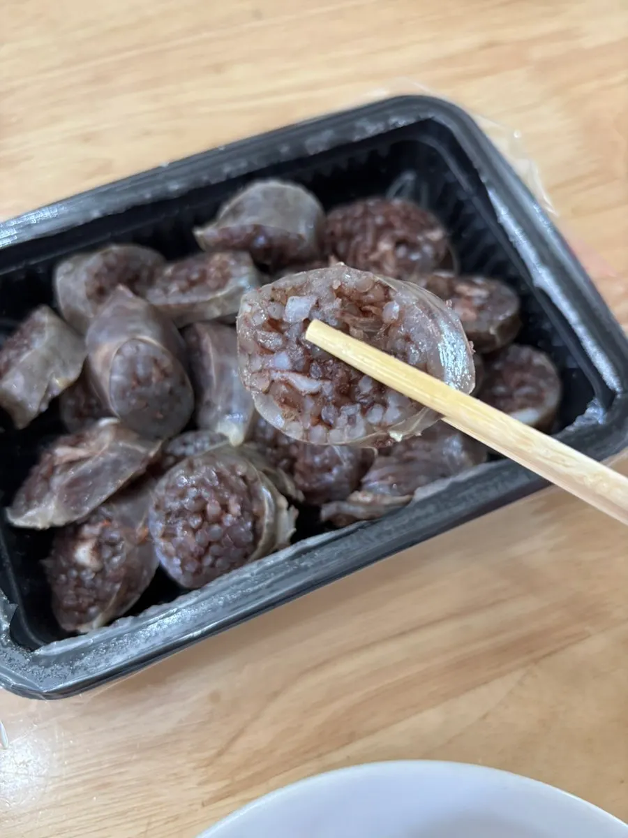 Sundae dipped in tteokbokki sauce