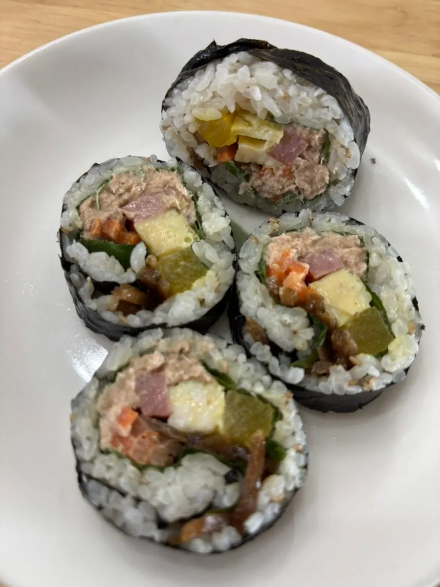 Tuna gimbap and tteokbokki laid out together