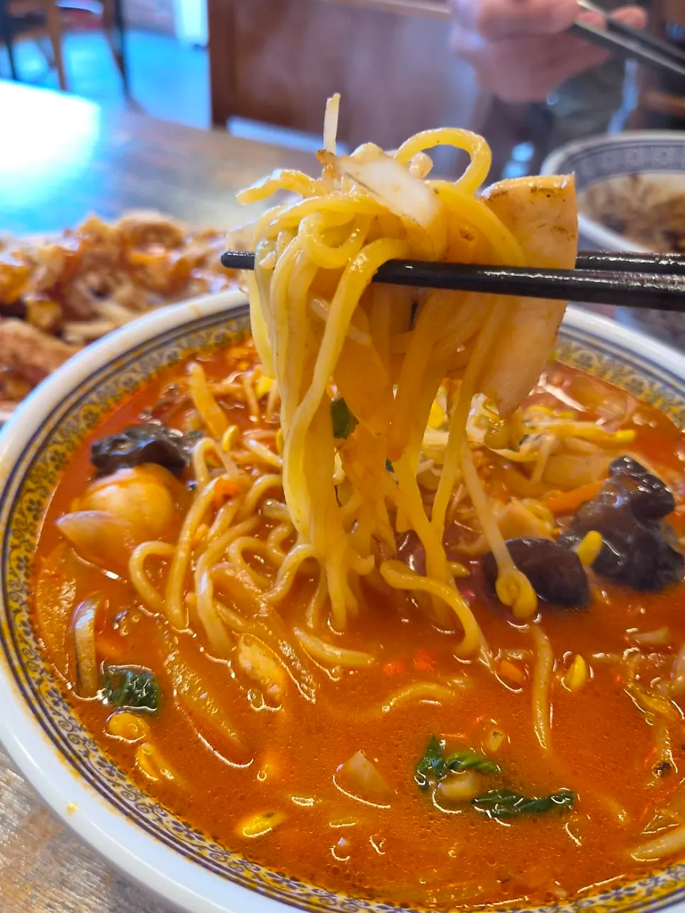 Chopsticks lifting up jjamppong ingredients
