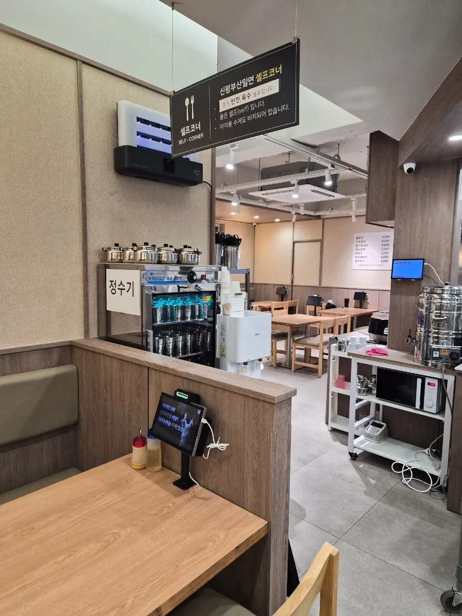 Neatly arranged seating inside the milmyeon restaurant