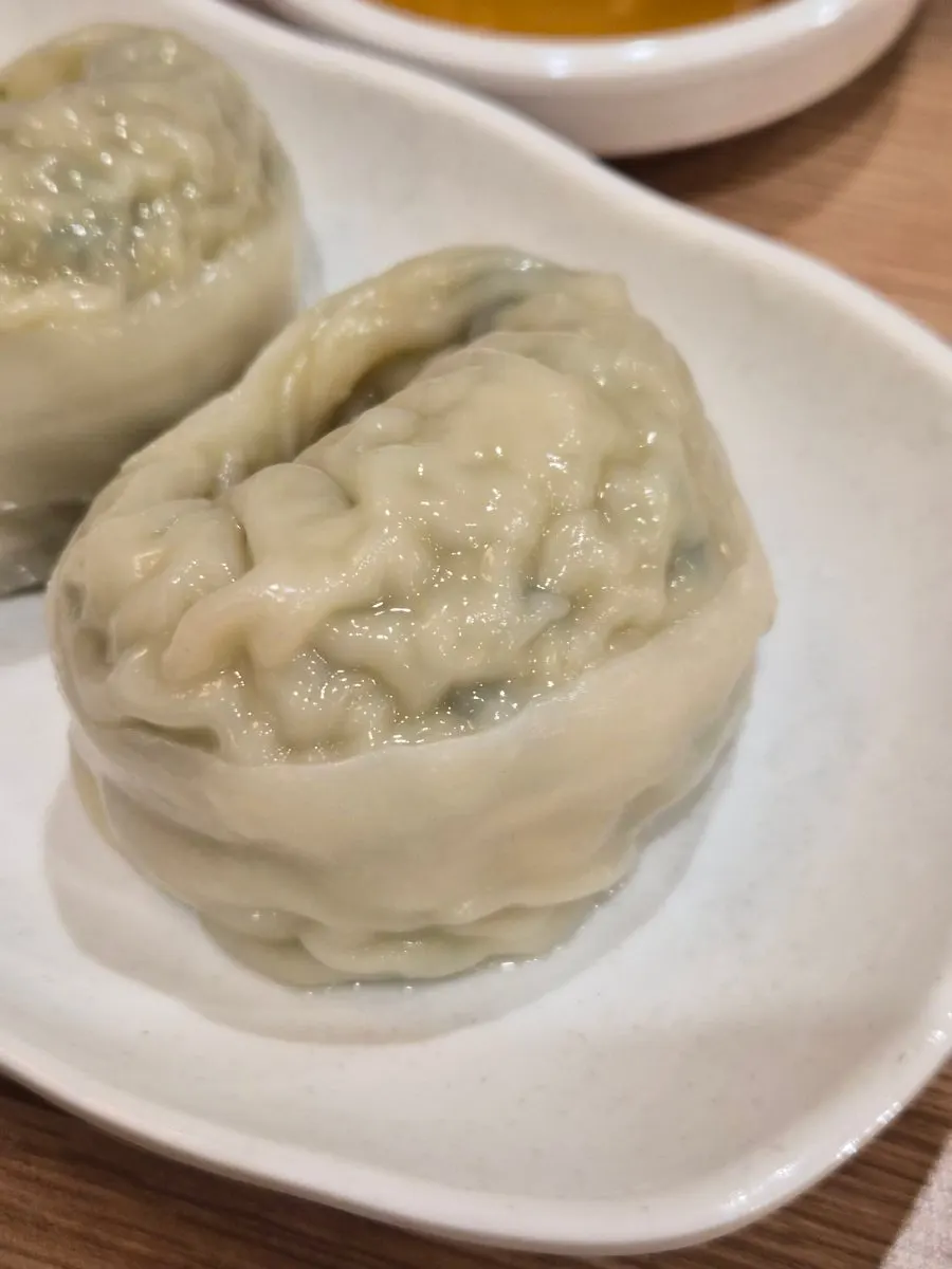 Table setting with bibim milmyeon and dumplings together