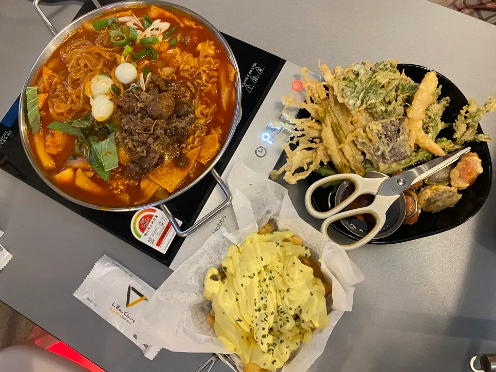 A table set with brisket instant tteokbokki and fritters