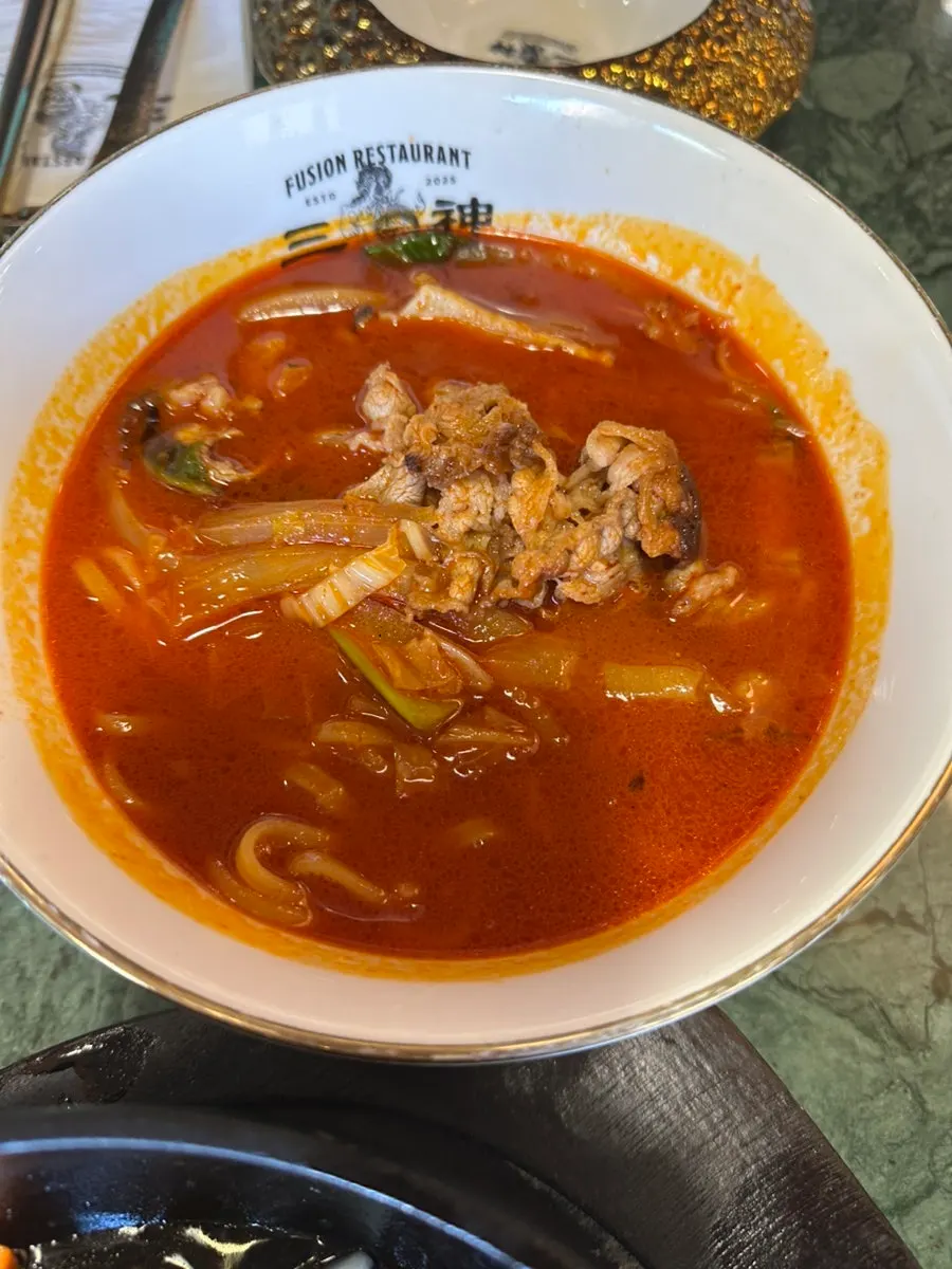 Close-up of meat jjamppong broth and ingredients