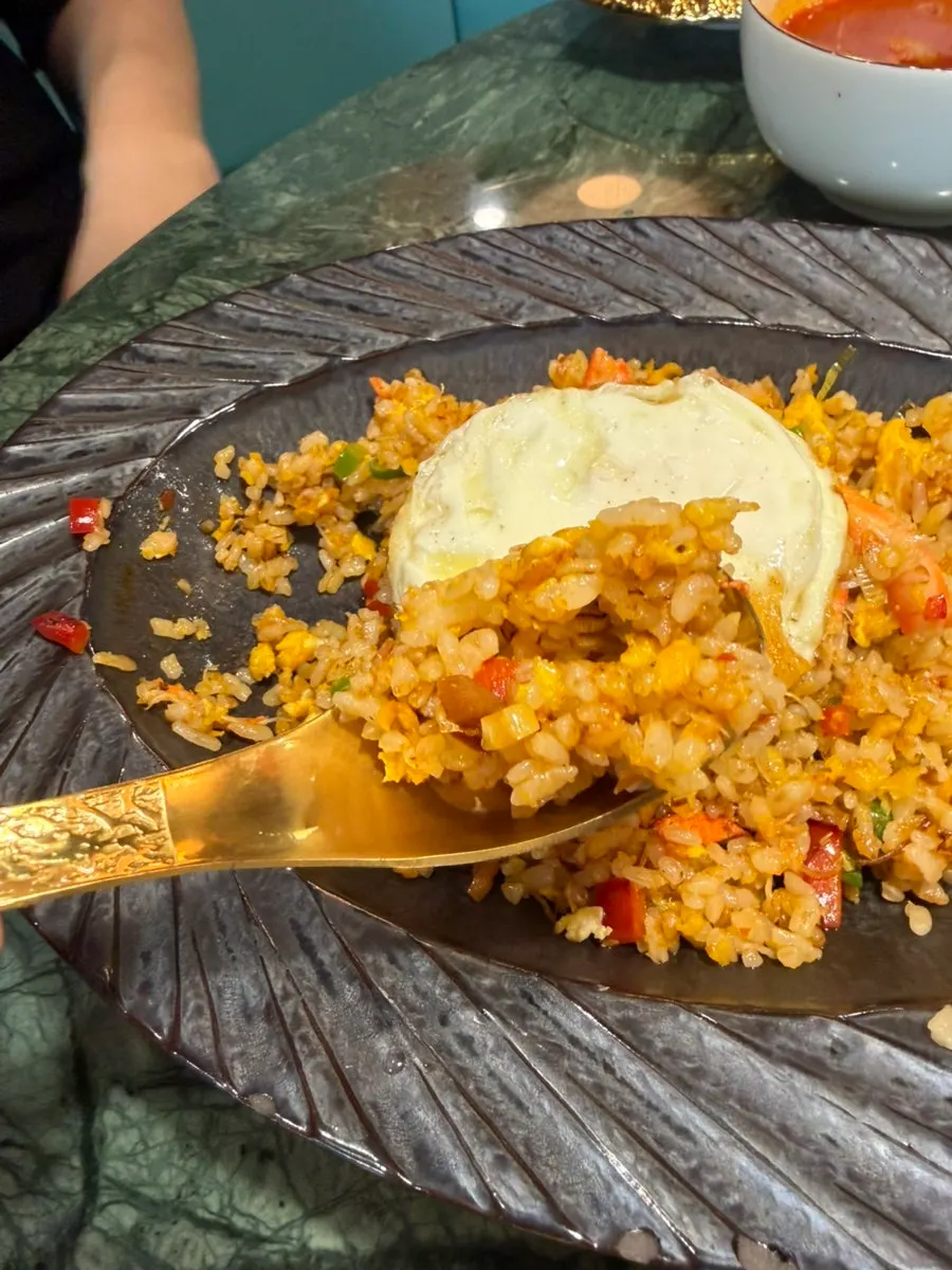 Crab fried rice topped with a fried egg