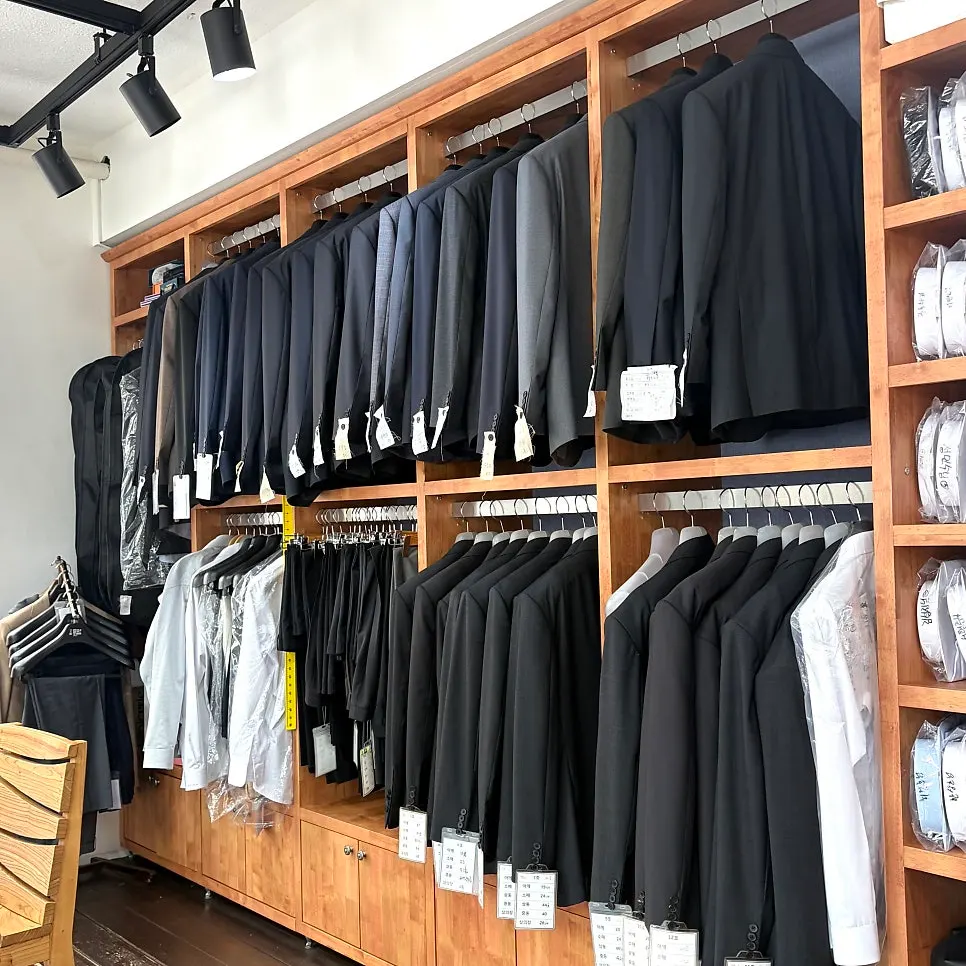 Sample custom-tailored suits hanging in the store