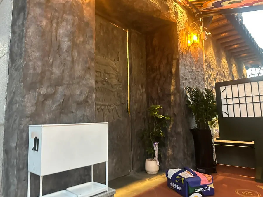 The actual entrance door on the right side of Samsin Garosu-gil