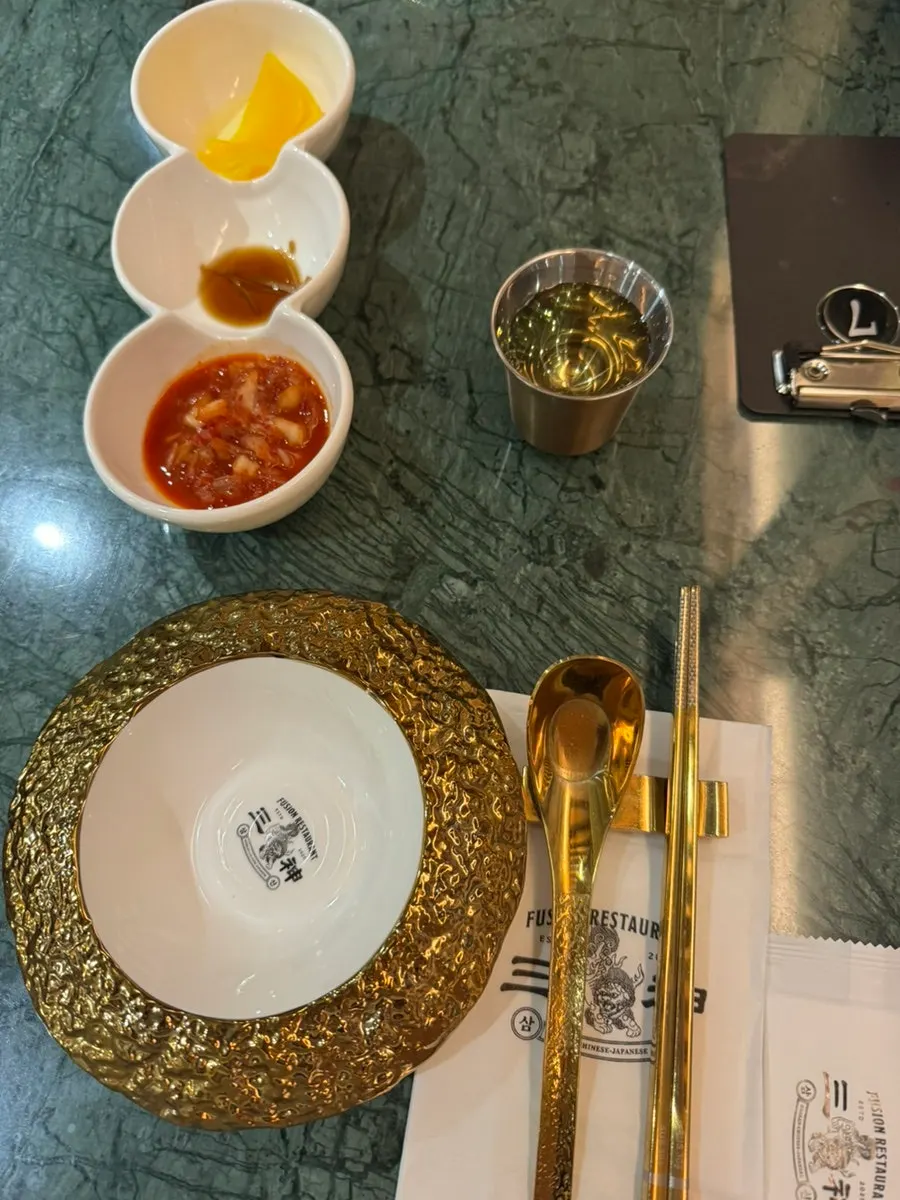 Table setting with golden spoons