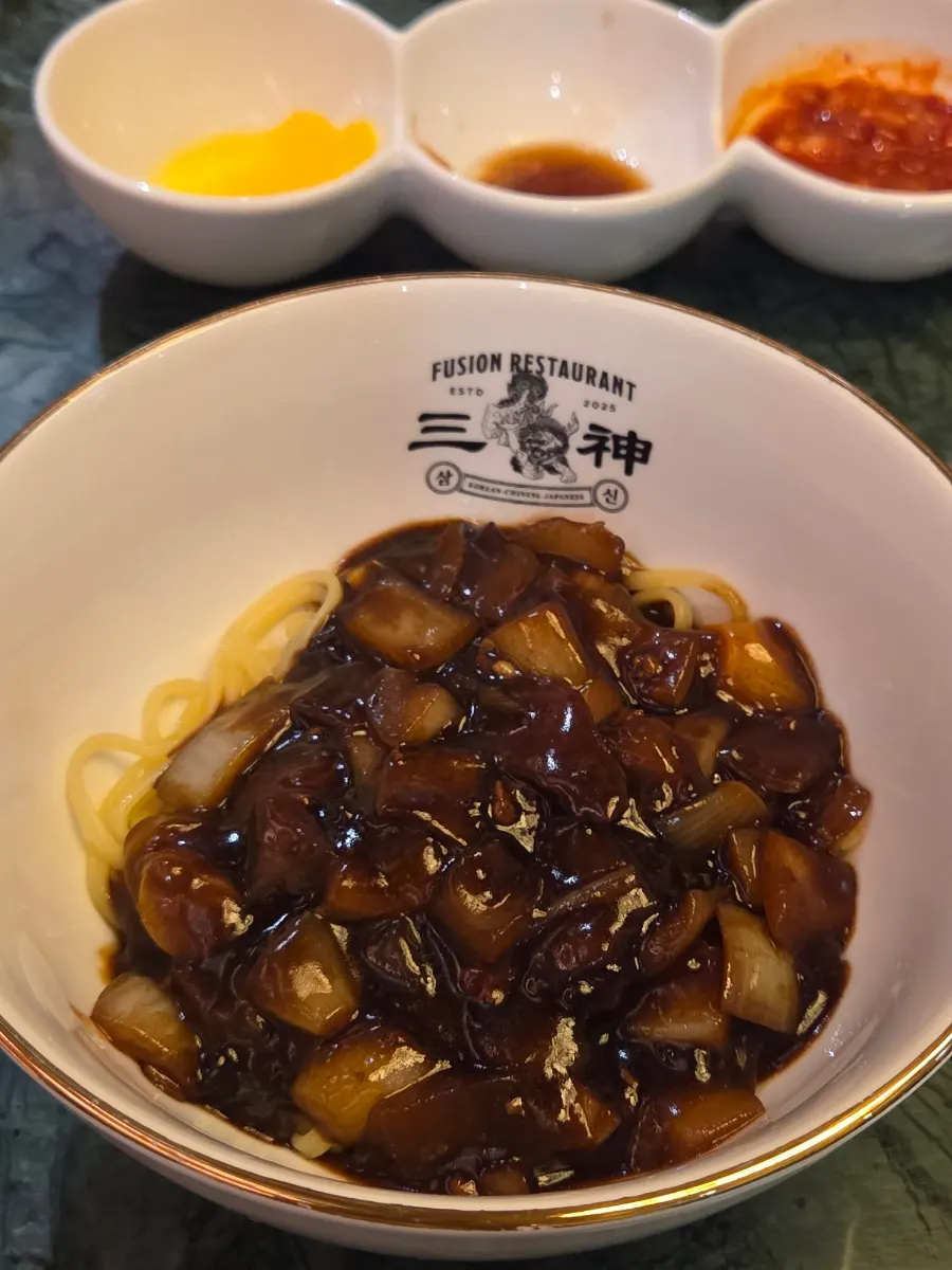 Potato jajangmyeon topped with gold leaf