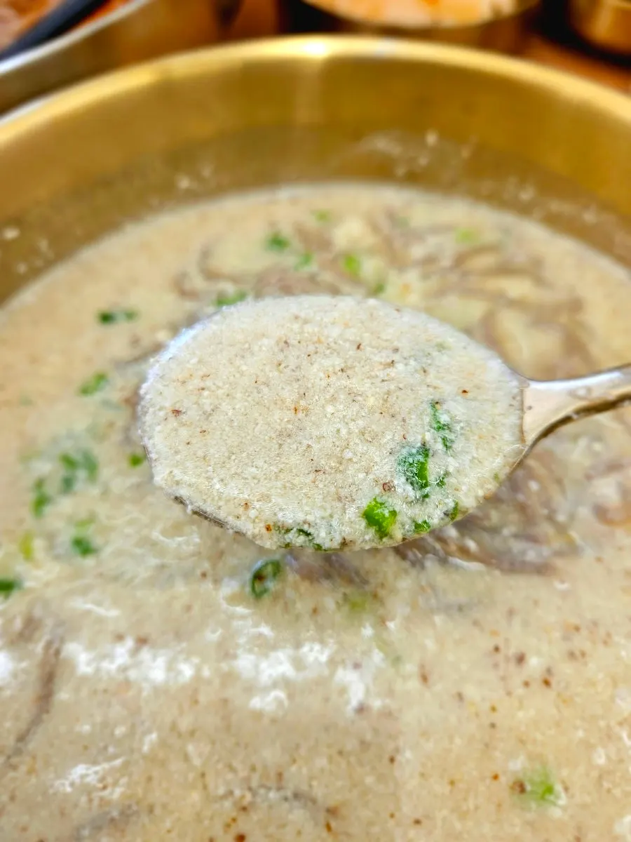 Vertical photo of the thick perilla broth hot noodles