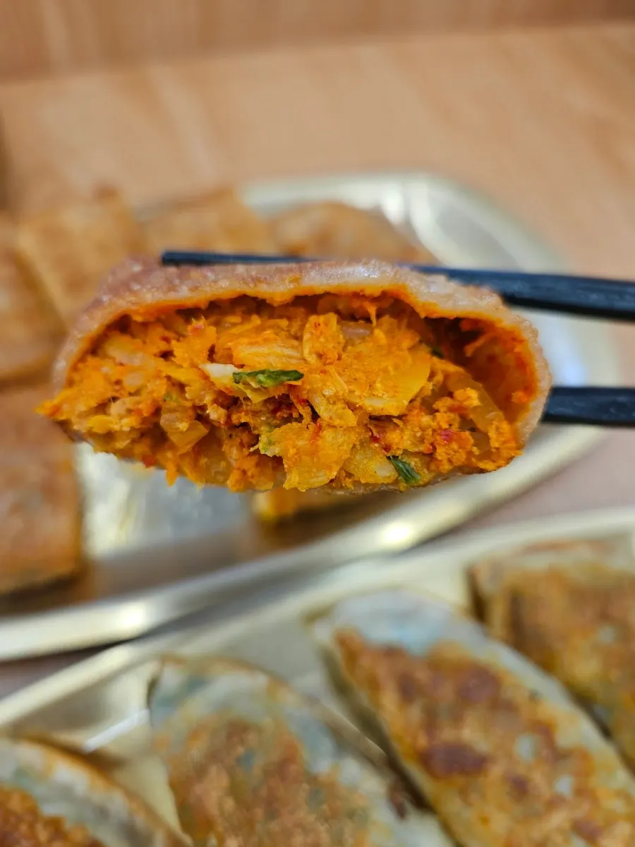 Close-up of the kimchi filling in the pancake roll