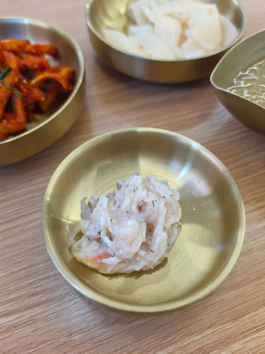 A separate bowl of dongchimi broth
