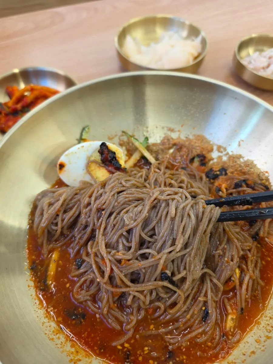 Bibim makguksu eaten with added dongchimi broth