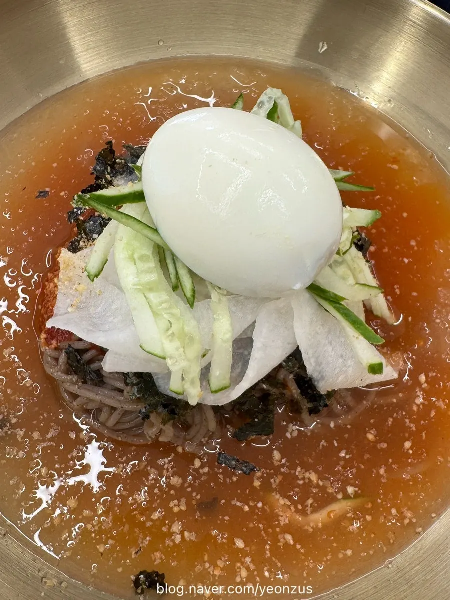 A bite of the sesame oil bibim makguksu