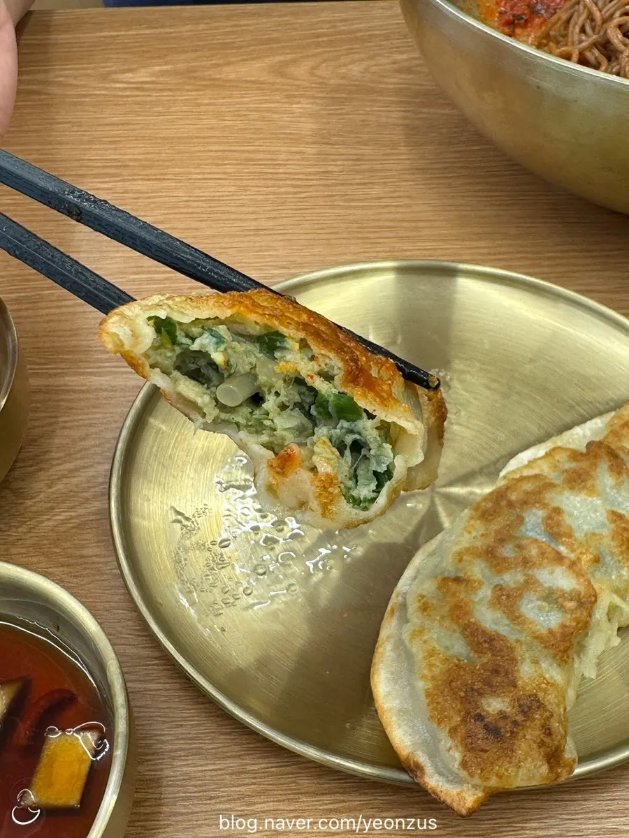 Crispy fried mandu dipped in soy sauce