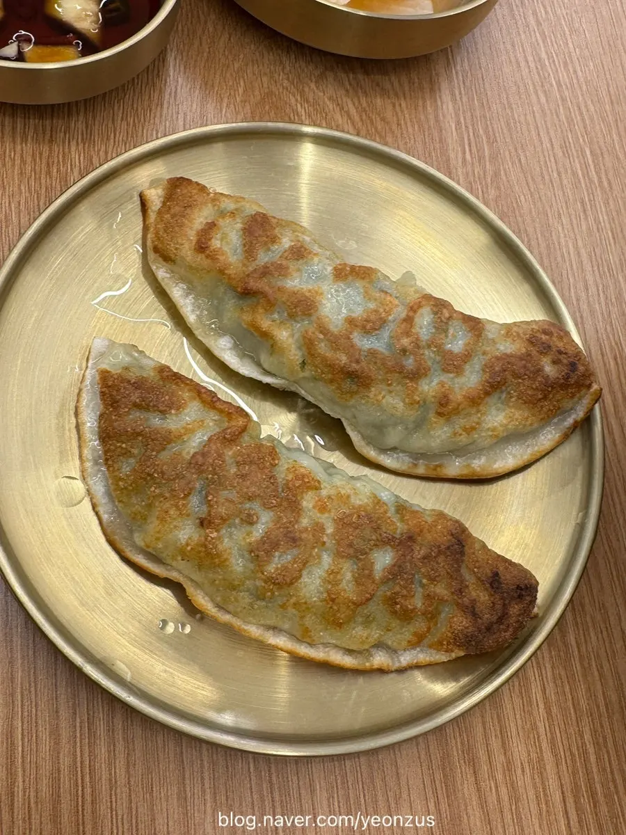 Fried mandu paired alongside the makguksu