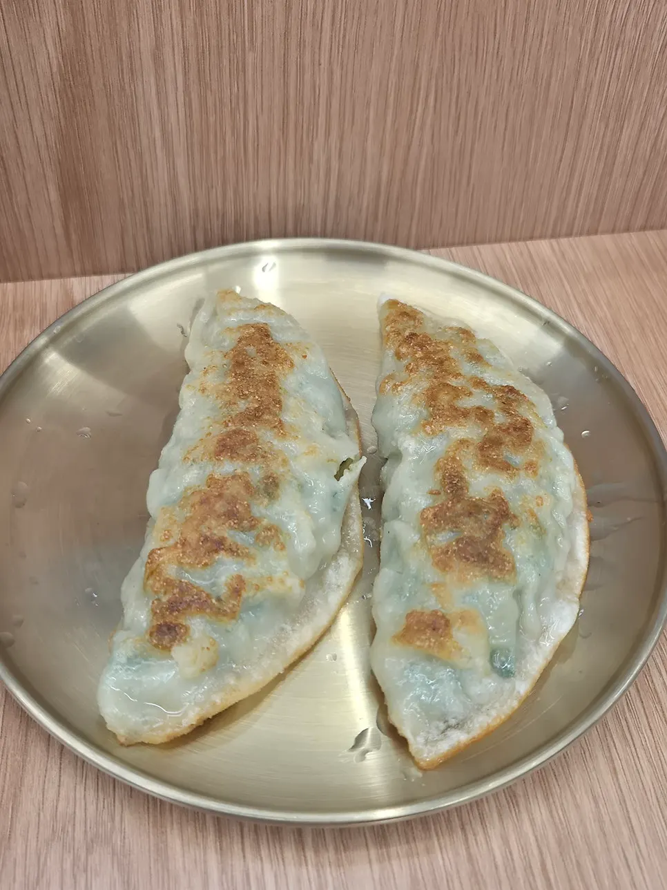 Crispy fried mandu dipped in soy sauce