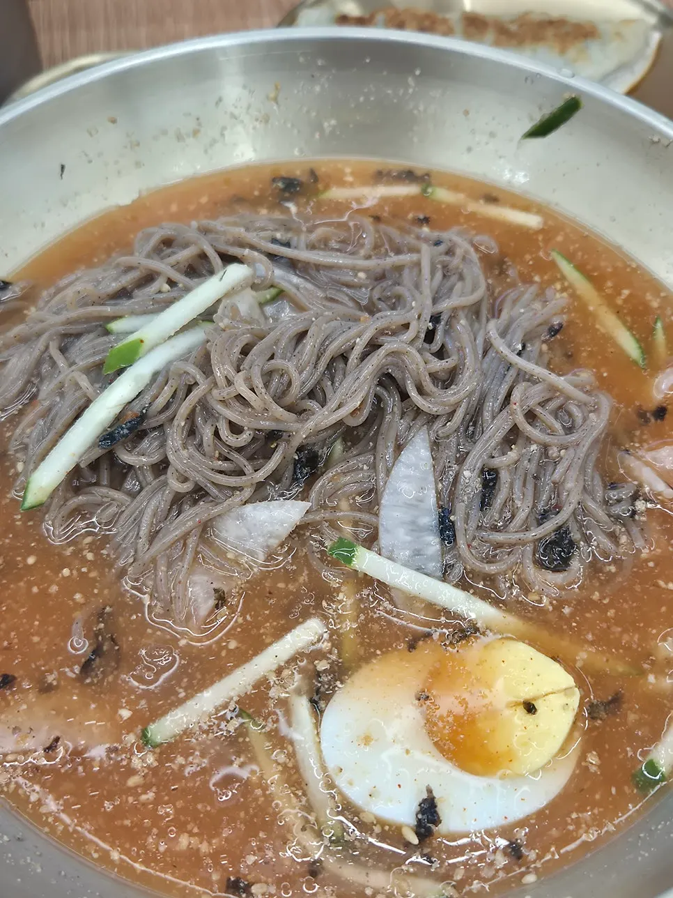 Lifting up the house-made buckwheat noodles