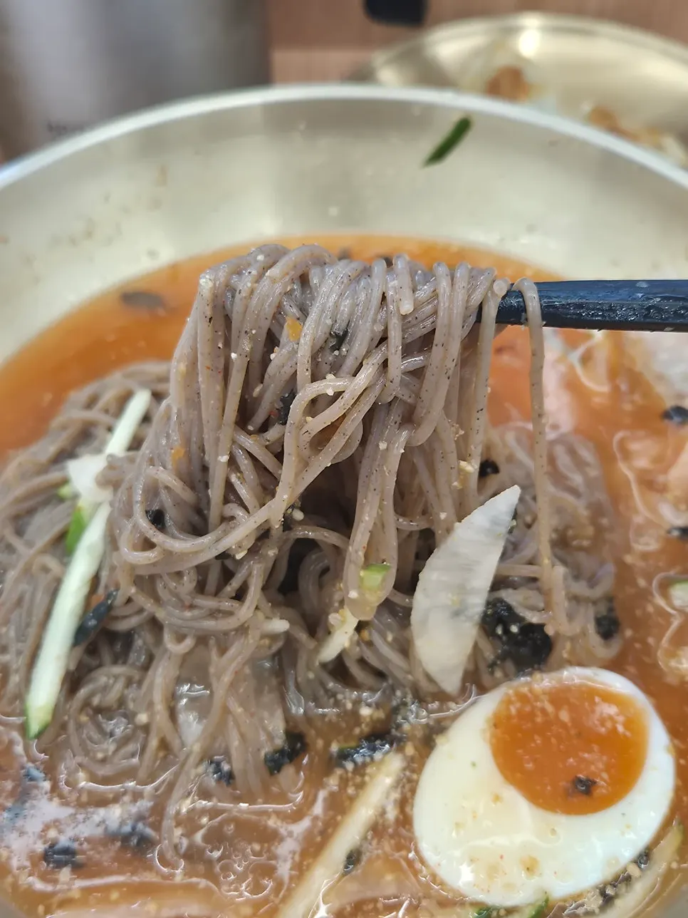 Close-up of the makguksu noodles and broth