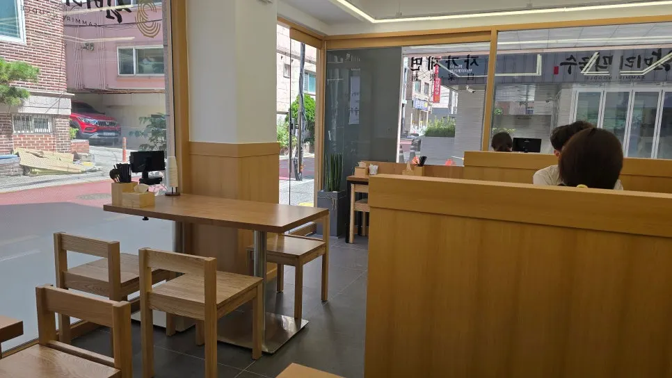 Wood-toned interior seating at Sammiri Makguksu