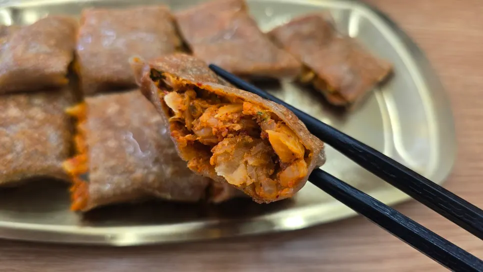 Close-up of filling spilling from the buckwheat pancake