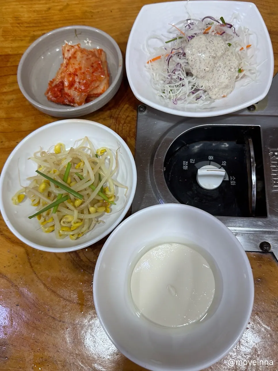 Basic side dishes including seasoned bean sprouts and napa cabbage kimchi
