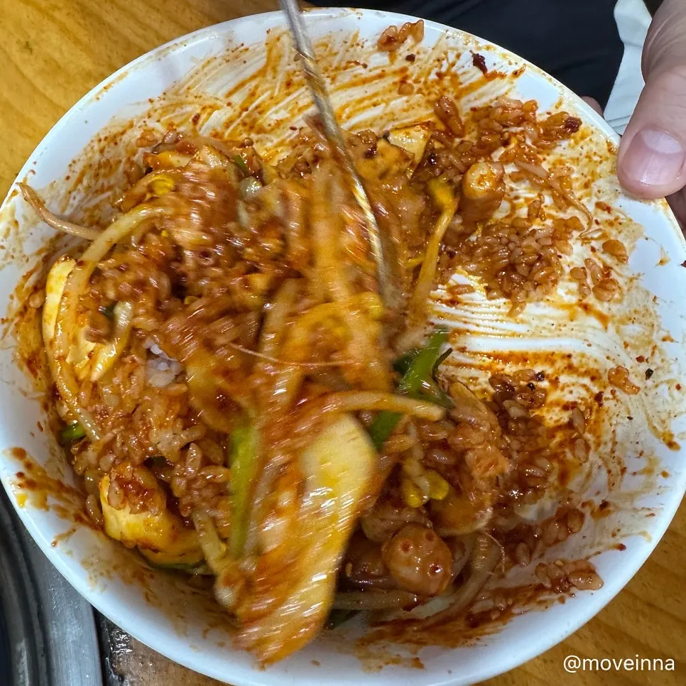 Octopus stir-fry rice mixed with bean sprouts and sesame oil