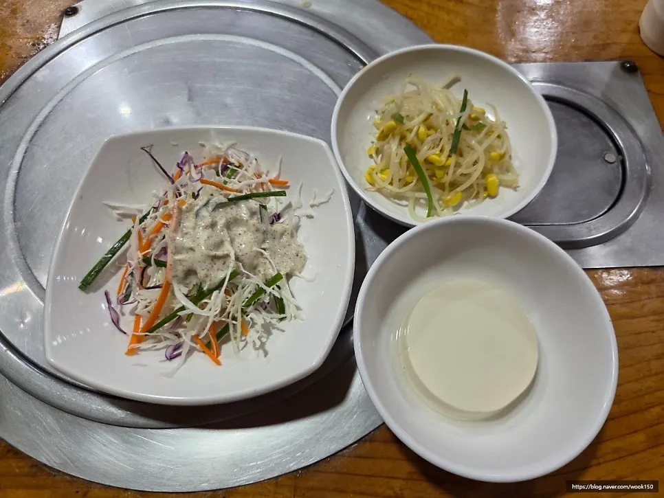 Table setting with side dishes, rice, and seaweed soup