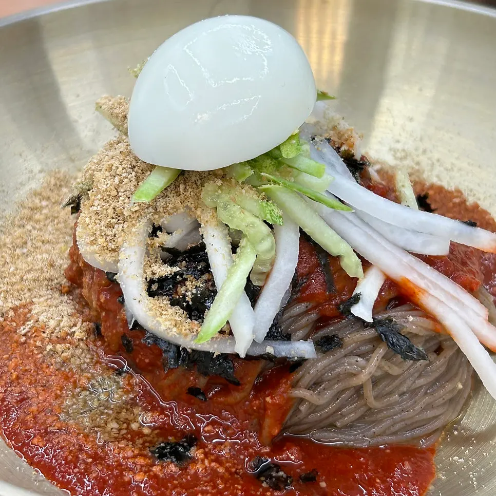 Bibim makguksu topped with sweet-and-spicy sauce