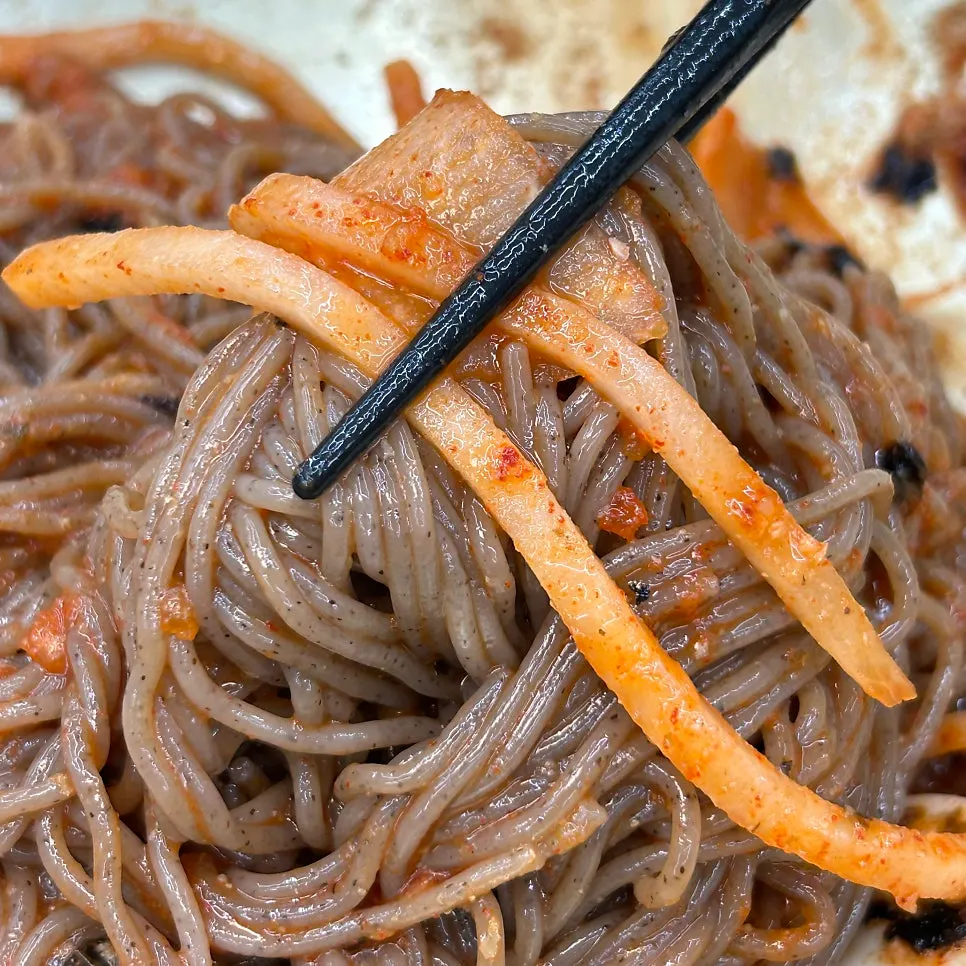 Sharing two bowls of dongchimi and bibim makguksu