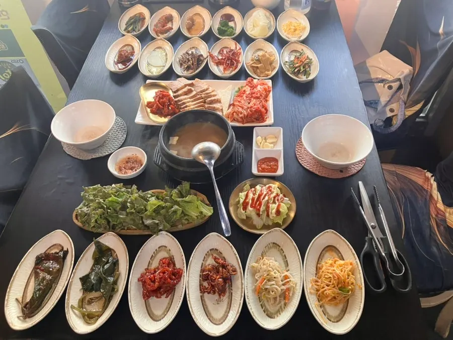 A table full of Korean side dishes