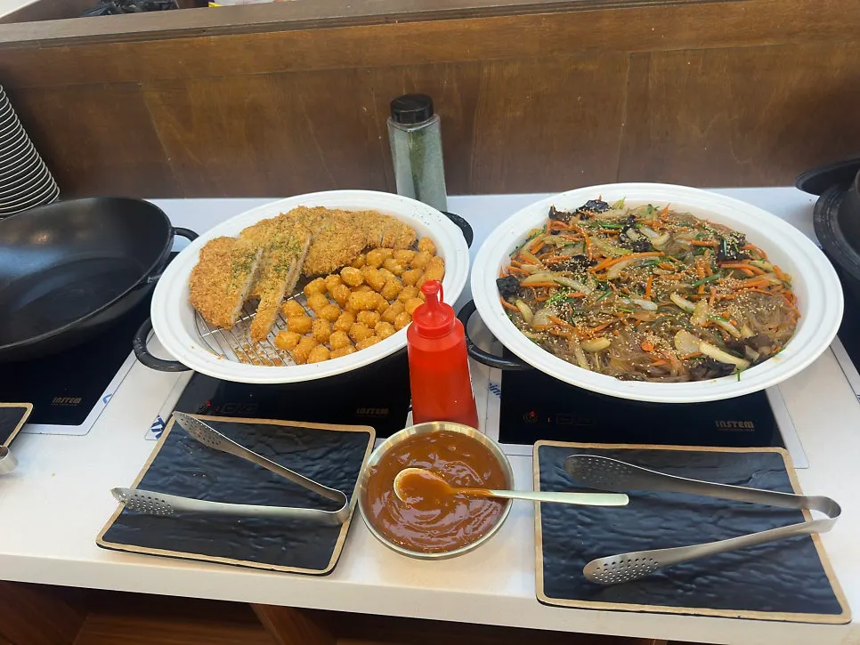 Self-bar with tteokbokki and japchae