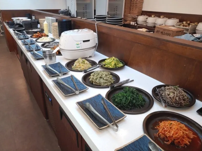 Self-bar stocked with Korean banchan