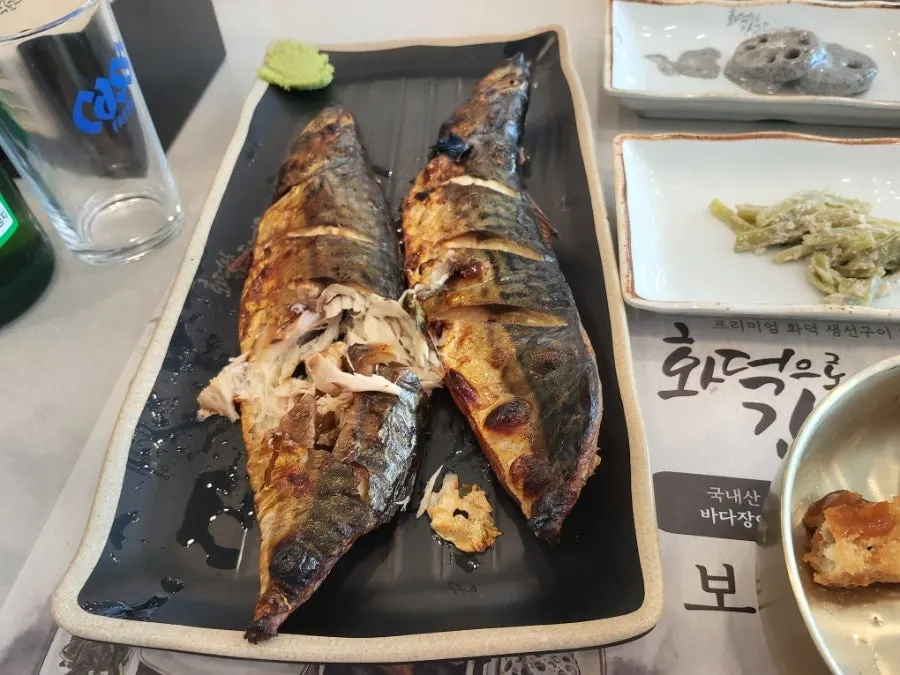 Golden-brown clay-oven grilled mackerel